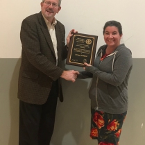 Dr. Kat Parys presenting the Merit Award in the area of Medical and Veterinary Entomology to Dr. Jerome Goddard